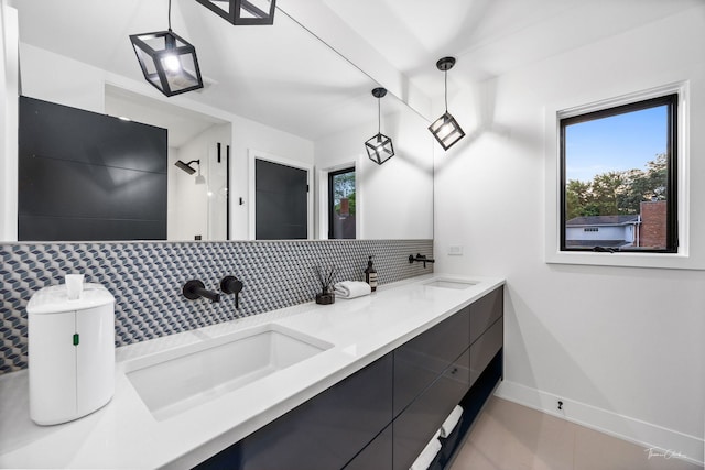 5401 Carpenter St, Downers Grove, IL 60515 - full bath with tasteful backsplash, double vanity, healthy amount of natural light, and tile patterned floors