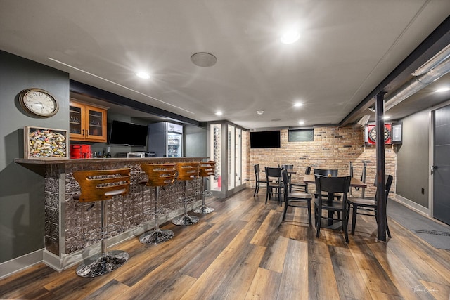 5401 Carpenter St, Downers Grove, IL 60515 - dining area with wood finished floors, a community bar, brick wall, and recessed lighting