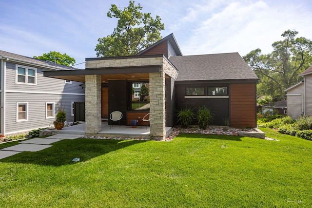 5401 Carpenter St, Downers Grove, IL 60515 - view of front of home with a front yard, stone siding, a shingled roof, and a patio