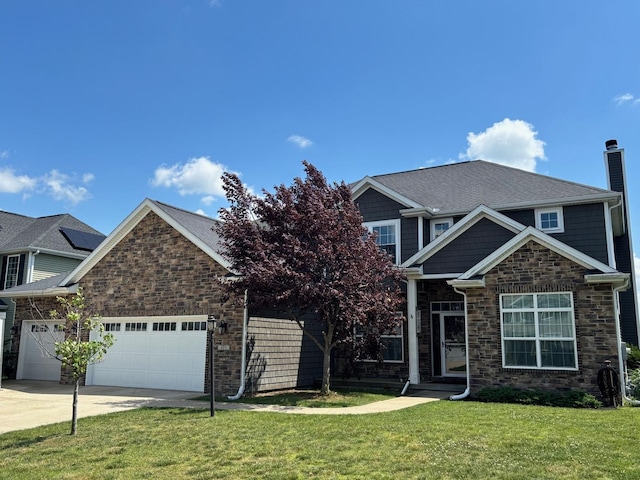 409 London Way, Savoy, IL 61874 - craftsman house with a front lawn, an attached garage, driveway, stone siding, and a chimney
