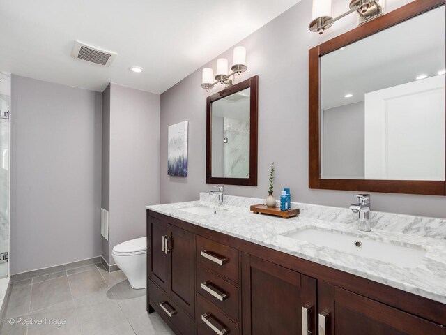 1100 W Montrose Ave Unit 207, Chicago, IL 60613 - full bathroom featuring double vanity, a shower, recessed lighting, and tile patterned floors