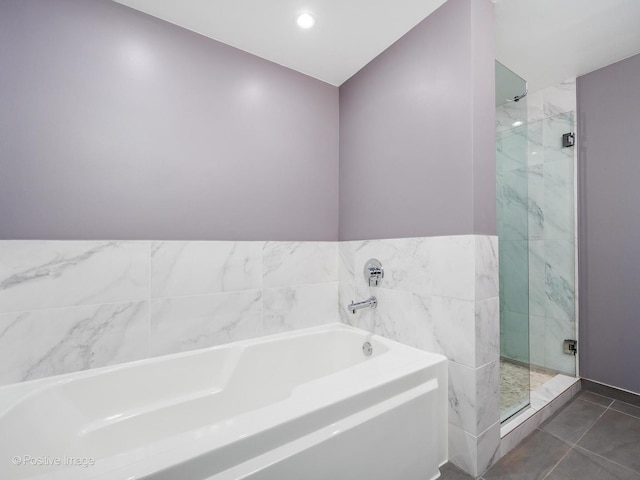 1100 W Montrose Ave Unit 207, Chicago, IL 60613 - bathroom featuring a garden tub and a shower stall