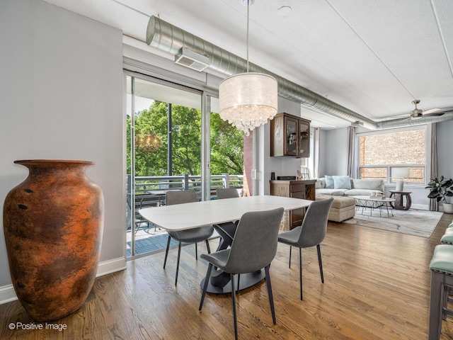 1100 W Montrose Ave Unit 207, Chicago, IL 60613 - dining space with wood finished floors and a chandelier