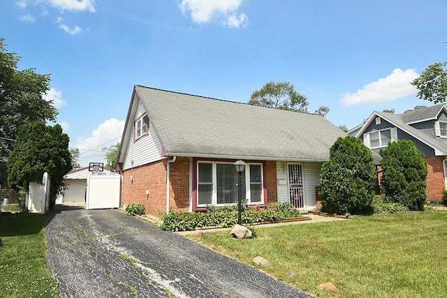 3806 168th St, Country Club Hills, IL 60478 - view of front of property with brick siding, a front lawn, an outdoor structure, and roof with shingles