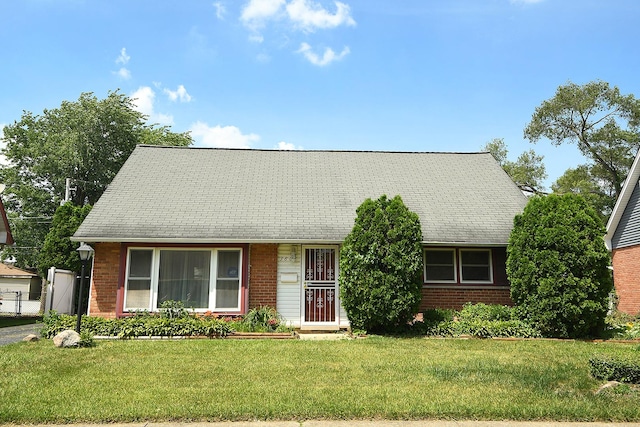 3806 168th St, Country Club Hills, IL 60478 - view of front facade featuring brick siding, a front lawn, and roof with shingles