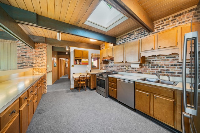309 Holiday Dr, Lake Holiday, IL 60552 - kitchen with appliances with stainless steel finishes, a wood ceiling with exposed beams, light colored carpet, a skylight, and brick wall