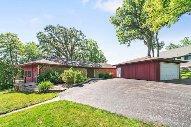 309 Holiday Dr, Lake Holiday, IL 60552 - mid-century inspired home featuring a front yard, an outdoor structure, and a detached garage