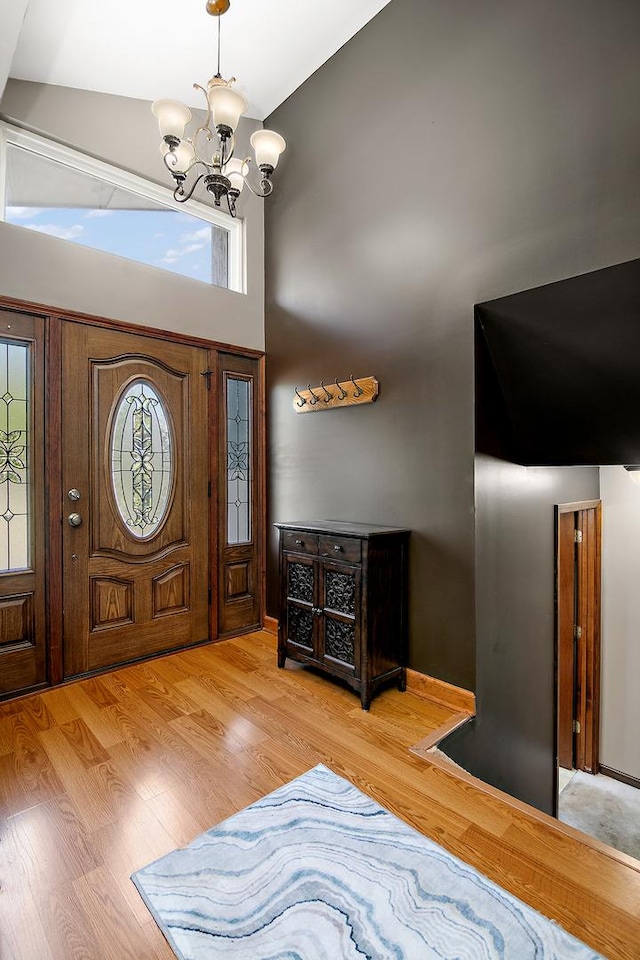 22939 E Dr, Richton Park, IL 60471 - foyer entrance featuring a chandelier, a high ceiling, and wood finished floors