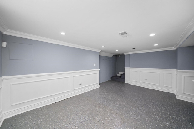 9632 S Yale Ave, Chicago, IL 60628 - spare room with a decorative wall, ornamental molding, a wainscoted wall, recessed lighting, and speckled floor