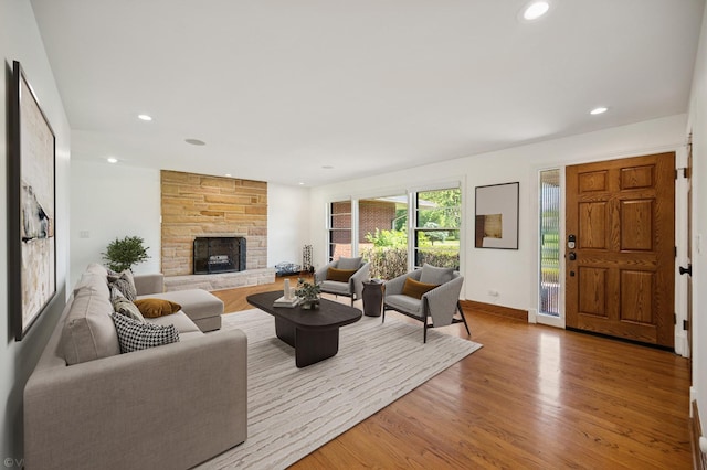 1050 Cedar Ln, Lake Forest, IL 60045 - living room with wood finished floors, a stone fireplace, and recessed lighting