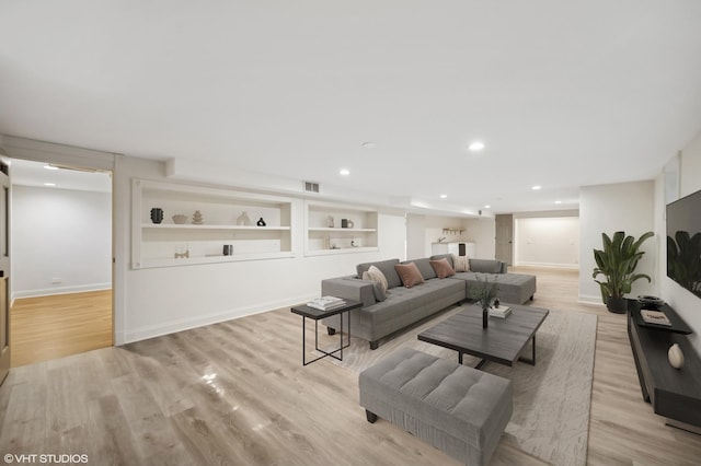 1050 Cedar Ln, Lake Forest, IL 60045 - living room with light wood finished floors, recessed lighting, and built in features