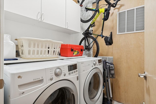 2047 N Leavitt St Unit 2N, Chicago, IL 60647 - washroom featuring washer and clothes dryer and cabinet space