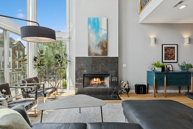 2047 N Leavitt St Unit 2N, Chicago, IL 60647 - living area with a towering ceiling, wood finished floors, healthy amount of natural light, and a fireplace