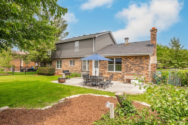 6730 Revere Rd, Downers Grove, IL 60516 - rear view of house featuring a fenced backyard, a patio area, brick siding, a chimney, and a shingled roof