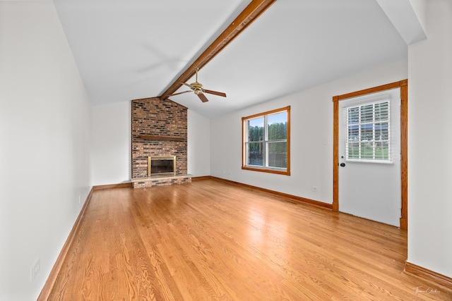 6730 Revere Rd, Downers Grove, IL 60516 - unfurnished living room featuring light wood-type flooring, a ceiling fan, and a brick fireplace
