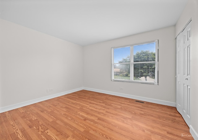 6730 Revere Rd, Downers Grove, IL 60516 - unfurnished bedroom featuring light wood-type flooring and a closet