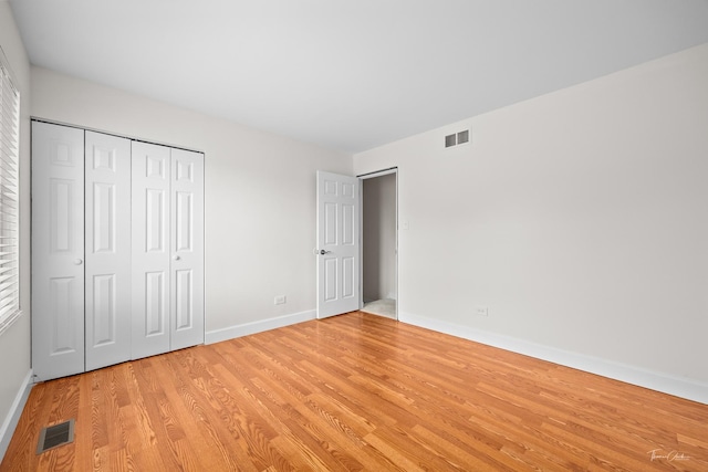 6730 Revere Rd, Downers Grove, IL 60516 - unfurnished bedroom featuring light wood-style flooring and a closet