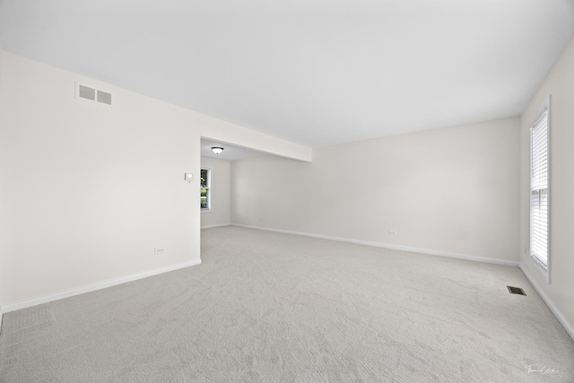 6730 Revere Rd, Downers Grove, IL 60516 - unfurnished room with plenty of natural light and light colored carpet