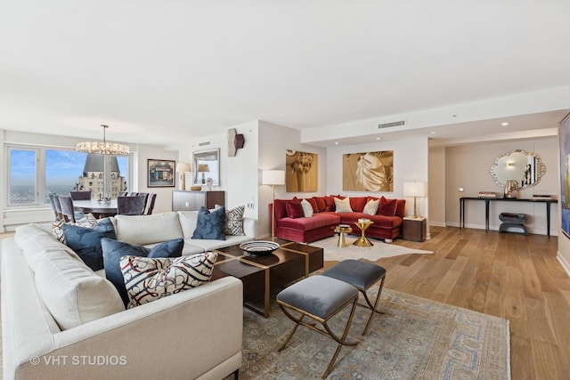 132 E Delaware Pl Unit 5101, Chicago, IL 60611 - living area featuring a chandelier, wood finished floors, and recessed lighting
