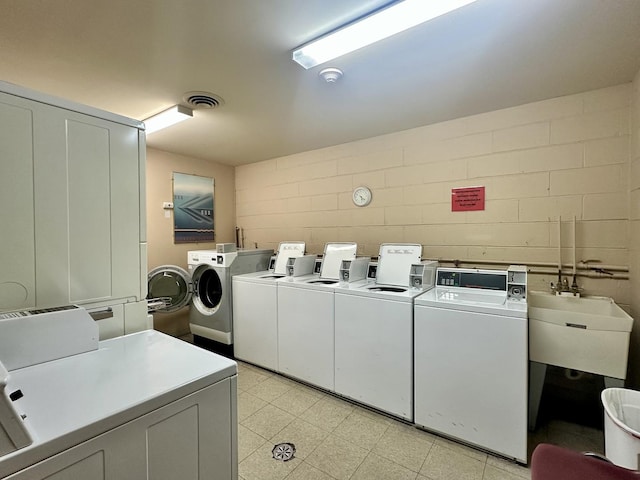 430 Walnut Ave Unit 2308, Lisle, IL 60532 - community laundry featuring washer and dryer and concrete block wall