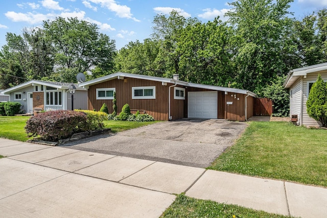 438 S Wolf Rd, Wheeling, IL 60090 - view of front of home featuring driveway and an attached garage