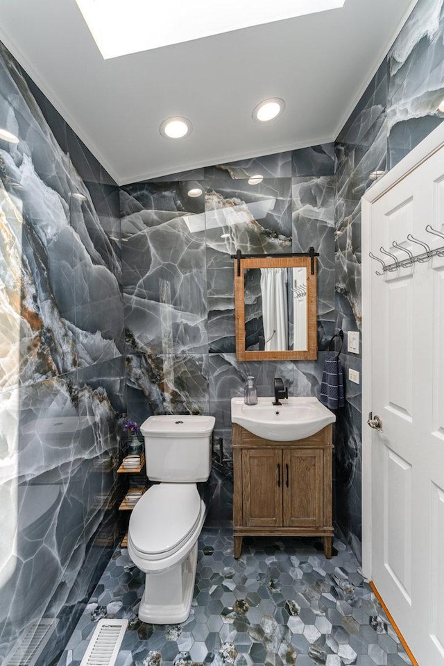 438 S Wolf Rd, Wheeling, IL 60090 - bathroom featuring tile walls, crown molding, vanity, and recessed lighting