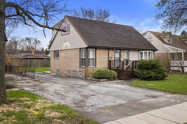 15607 Rose Dr, South Holland, IL 60473 - view of front of property with driveway, a shingled roof, and brick siding