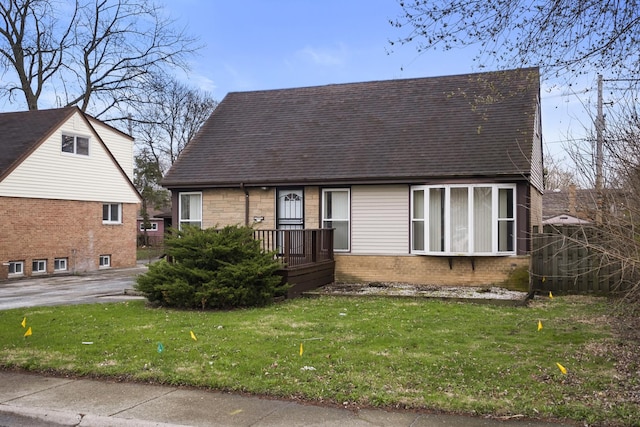 15607 Rose Dr, South Holland, IL 60473 - view of front of house featuring roof with shingles, a front yard, and brick siding