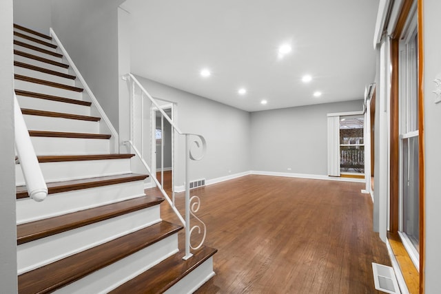 15607 Rose Dr, South Holland, IL 60473 - unfurnished living room featuring stairway, wood finished floors, and recessed lighting