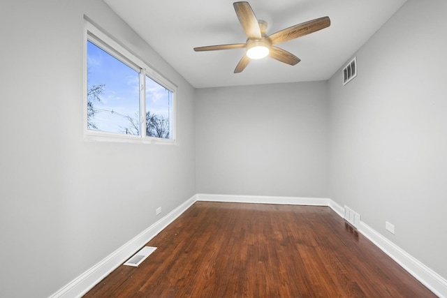 15607 Rose Dr, South Holland, IL 60473 - empty room featuring a ceiling fan and dark wood-type flooring
