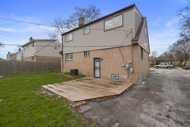15607 Rose Dr, South Holland, IL 60473 - rear view of house with brick siding, a deck, and a chimney