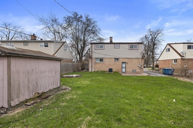 15607 Rose Dr, South Holland, IL 60473 - rear view of property featuring brick siding, a storage shed, and a patio