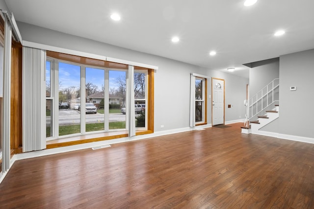 15607 Rose Dr, South Holland, IL 60473 - unfurnished living room featuring recessed lighting, wood finished floors, and stairway