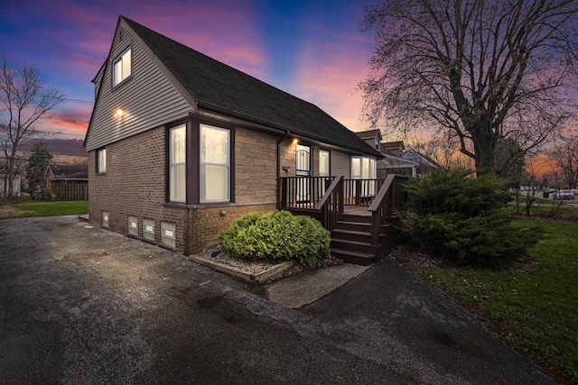 15607 Rose Dr, South Holland, IL 60473 - view of front of property featuring a wooden deck, a shingled roof, and brick siding