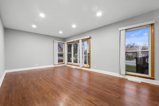 15607 Rose Dr, South Holland, IL 60473 - unfurnished room featuring recessed lighting, plenty of natural light, and wood finished floors