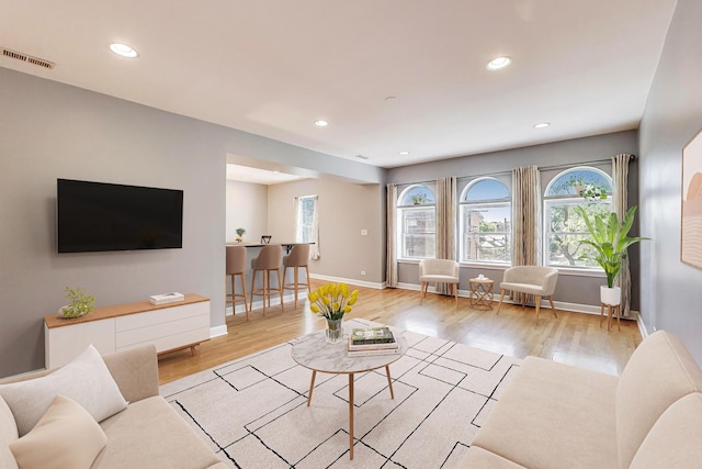 2618 W Rosemont Ave Unit 3, Chicago, IL 60659 - living room with plenty of natural light, wood finished floors, and recessed lighting