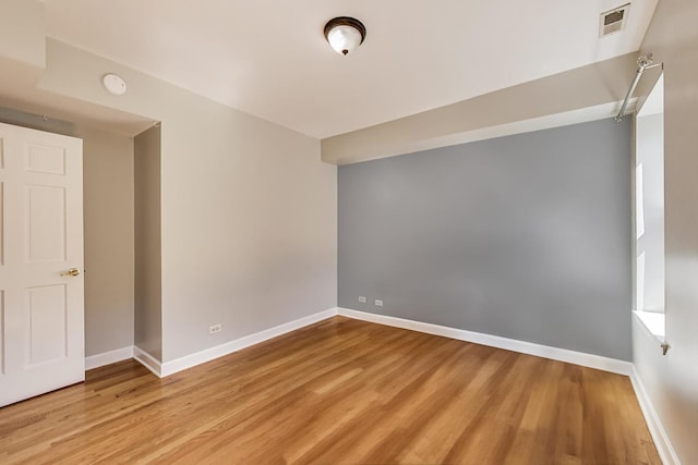 2618 W Rosemont Ave Unit 3, Chicago, IL 60659 - empty room featuring wood finished floors and a smoke detector