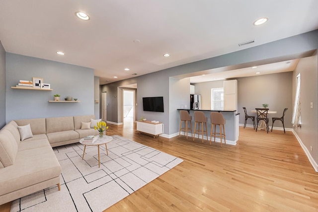 2618 W Rosemont Ave Unit 3, Chicago, IL 60659 - living area featuring light wood-type flooring and recessed lighting