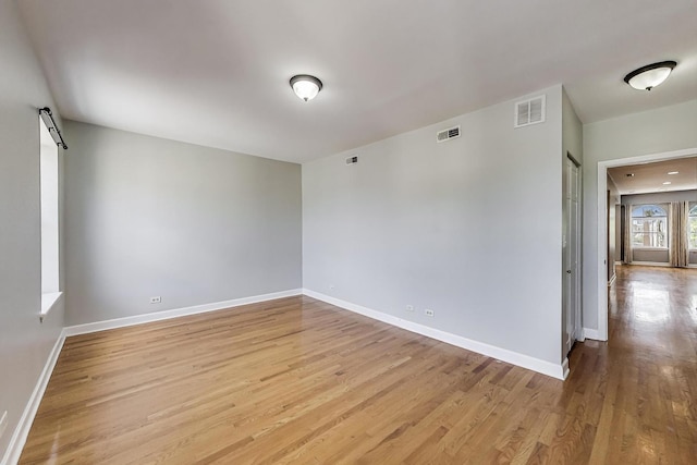 2618 W Rosemont Ave Unit 3, Chicago, IL 60659 - unfurnished room featuring wood finished floors and baseboards