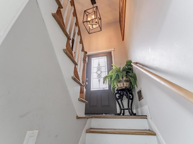721 Lacy Ave, Streamwood, IL 60107 - staircase with a chandelier and a towering ceiling