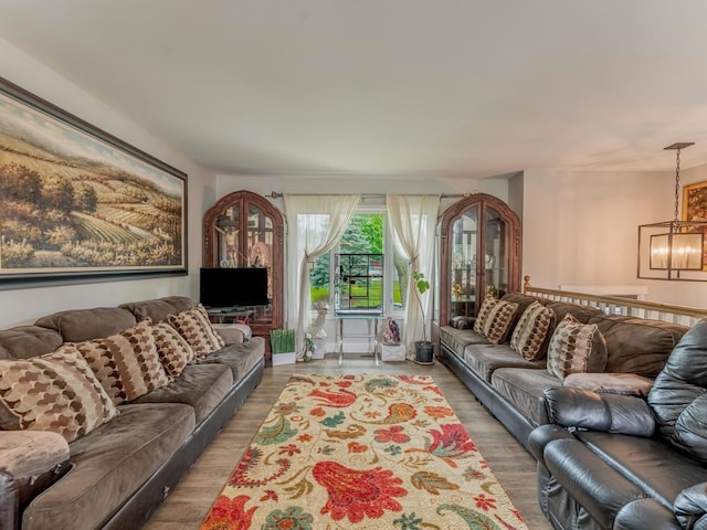 721 Lacy Ave, Streamwood, IL 60107 - living room featuring light wood finished floors and a chandelier