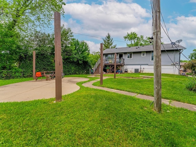 721 Lacy Ave, Streamwood, IL 60107 - view of green lawn with stairs and a deck