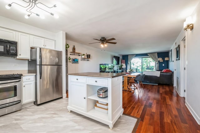 6221 N Niagara Ave Unit 507, Chicago, IL 60631 - kitchen featuring stainless steel appliances, open floor plan, white cabinets, ceiling fan, and open shelves