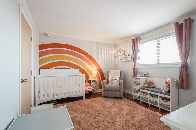 6221 N Niagara Ave Unit 507, Chicago, IL 60631 - bedroom featuring a nursery area and wood finished floors