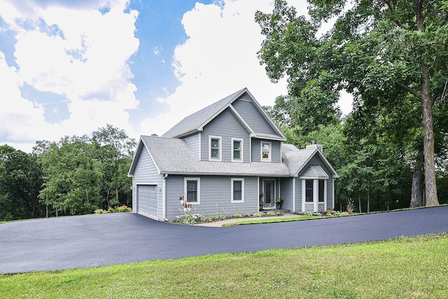 3 Laurel Ct, Galena, IL 61036 - view of front of property with driveway, a chimney, an attached garage, roof with shingles, and a front yard