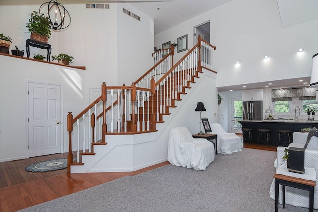 3 Laurel Ct, Galena, IL 61036 - living room with a high ceiling, wood finished floors, and stairs