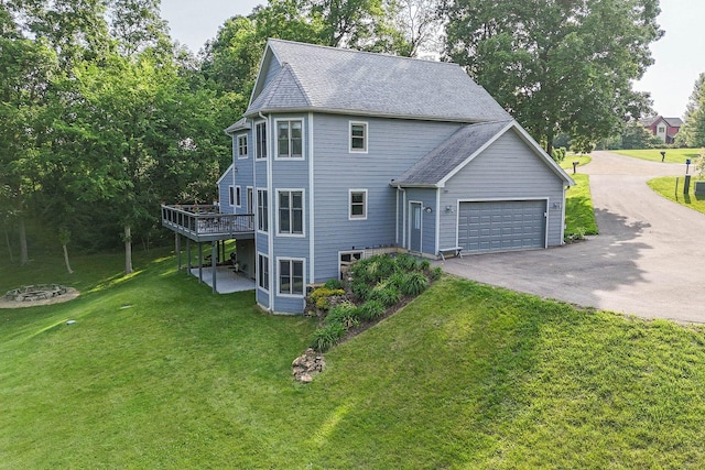 3 Laurel Ct, Galena, IL 61036 - view of side of property featuring driveway, an attached garage, a yard, a wooden deck, and roof with shingles