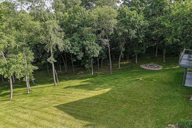 3 Laurel Ct, Galena, IL 61036 - view of grassy yard with an outdoor fire pit and a wooden deck