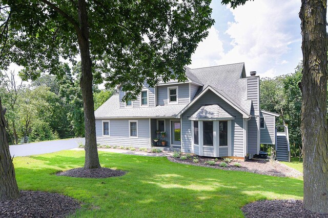 3 Laurel Ct, Galena, IL 61036 - view of front of house featuring stairs, a front lawn, and a chimney