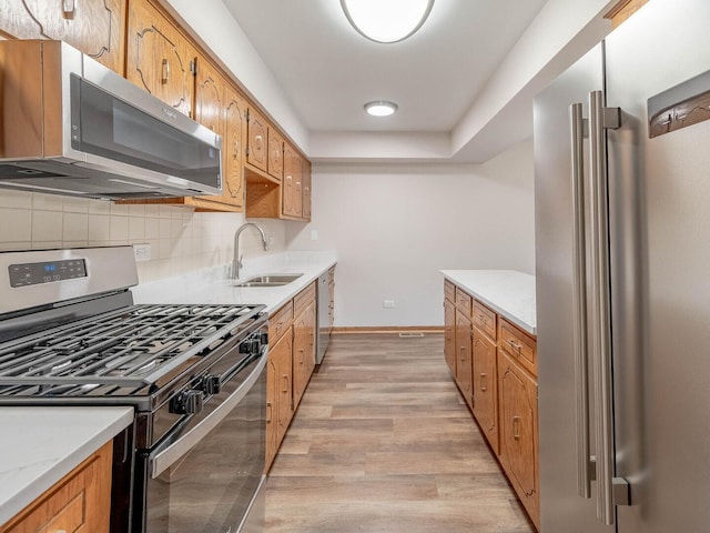 15954 78th Ave, Tinley Park, IL 60477 - kitchen featuring stainless steel appliances, light wood finished floors, and tasteful backsplash